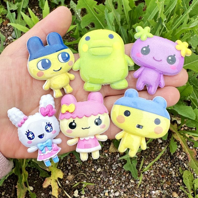 45mm Cartoon Tamagotchi dubbel - Phone Accessories Beads recensie en prijs