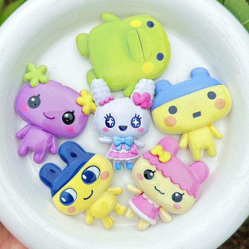 45mm Cartoon Tamagotchi dubbel - Phone Accessories Beads recensie en prijs